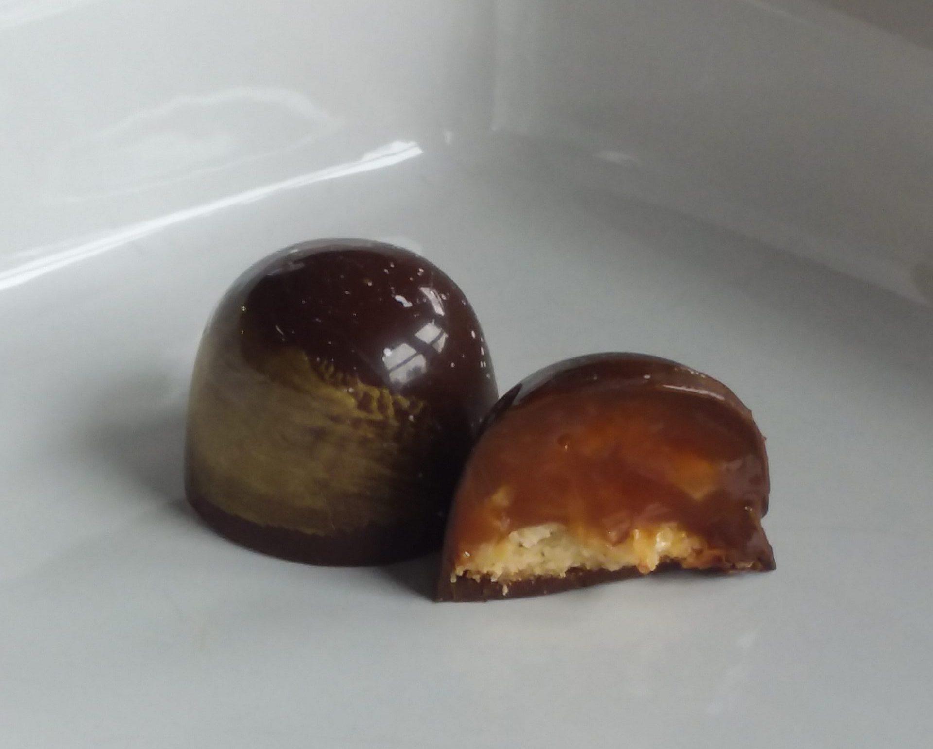 Smooth caramel ganache with coconut folded in paired with a gluten free shortbread cookie.